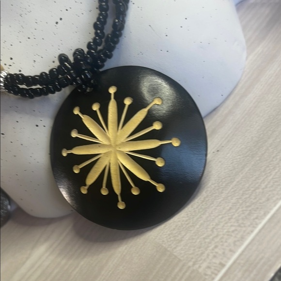 Black and Gold Necklace with Textured Beads and Starburst Pendant - Picture 3 of 4